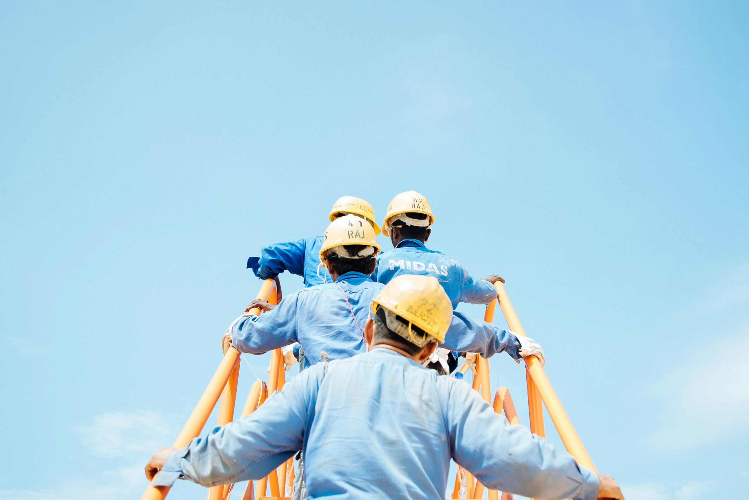 EHS multiple workers external staircase yellow and blue